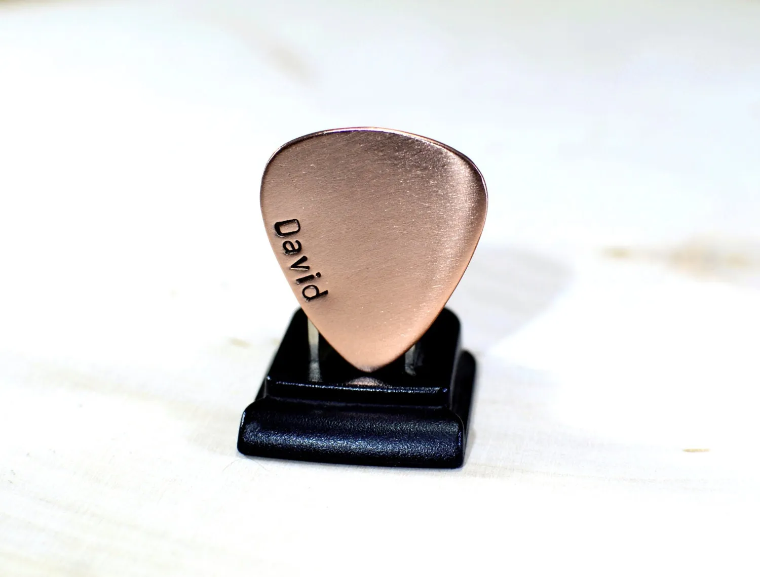 Copper guitar pick with personalized name