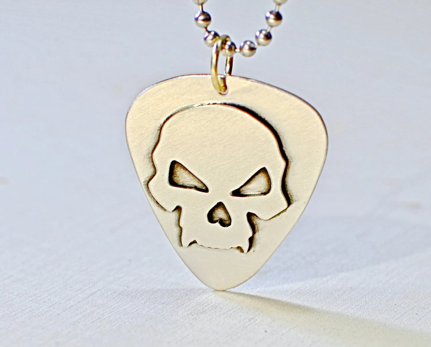 Skull design on sterling silver guitar pick for a bad ass guitarist