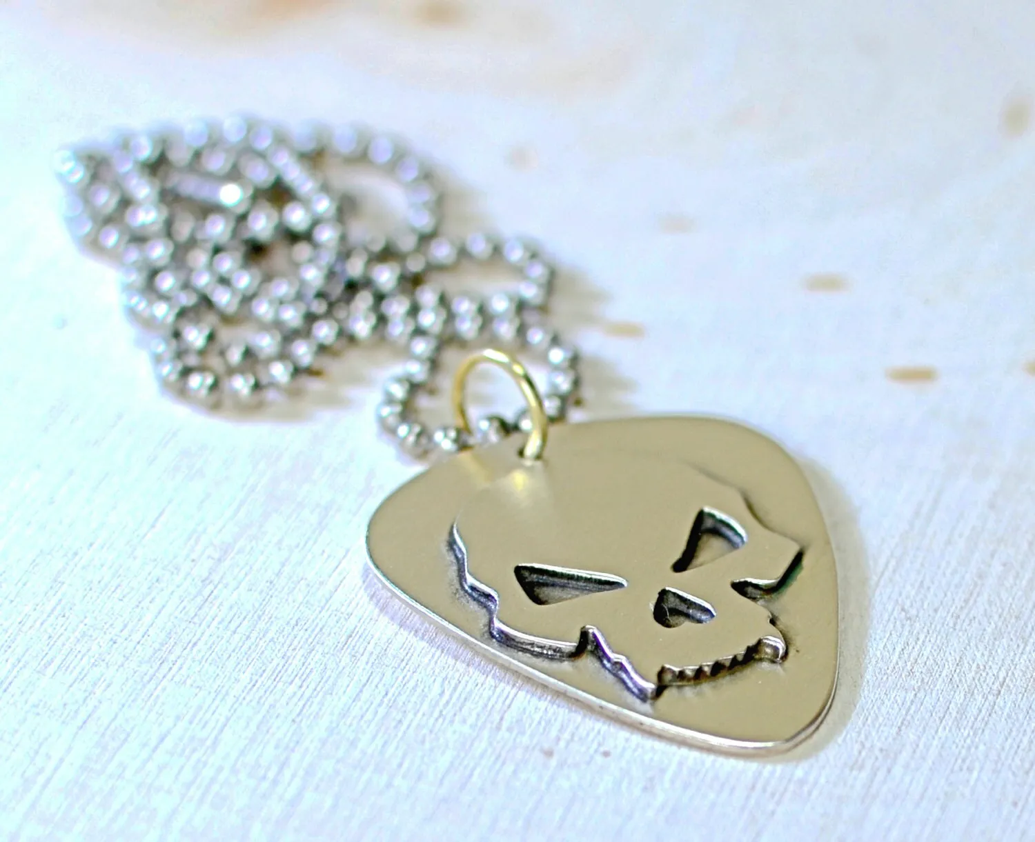 Skull design on sterling silver guitar pick for a bad ass guitarist